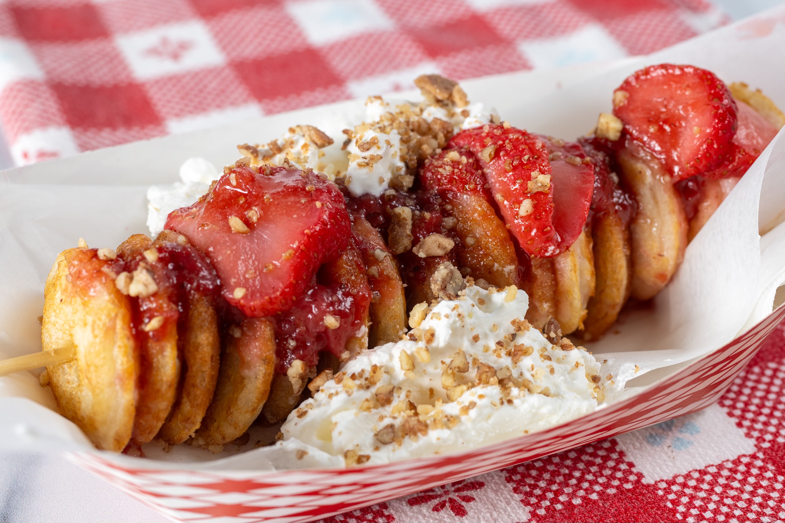 poffertjes with strawberries, whipped cream, and pecans